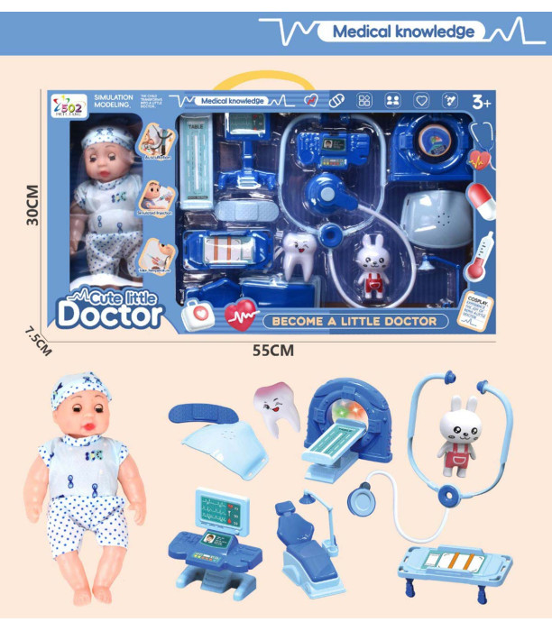BABY WITH A DOCTOR KIT IN A LARGE BOX