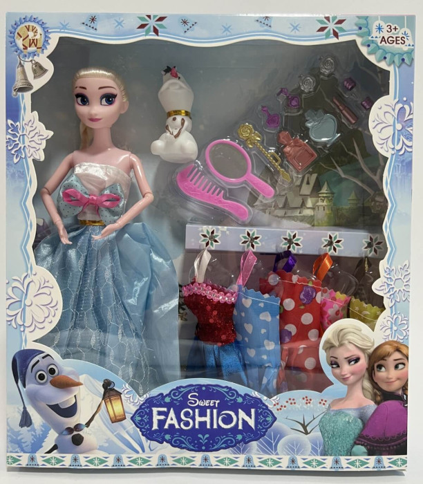 DOLL WITH SNOWMAN AND CLOTHES IN A BOX 